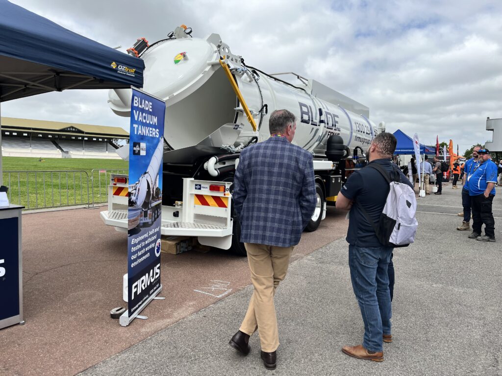 FIRMUS Group AUSJET24 Exhibition site - Blade Vacuum Semi Trailer in background with Lance McKay